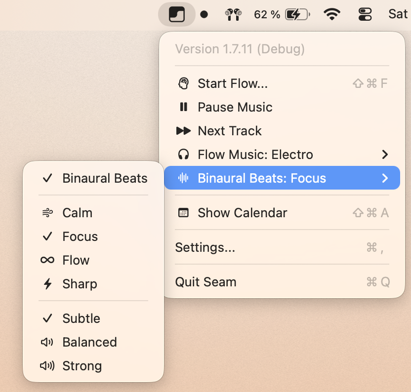 Seam menu bar showing Flow Music set to Electro and Binaural Beats set to Focus, with profile options Calm, Focus, Flow, Sharp and intensity options Subtle, Balanced, Strong