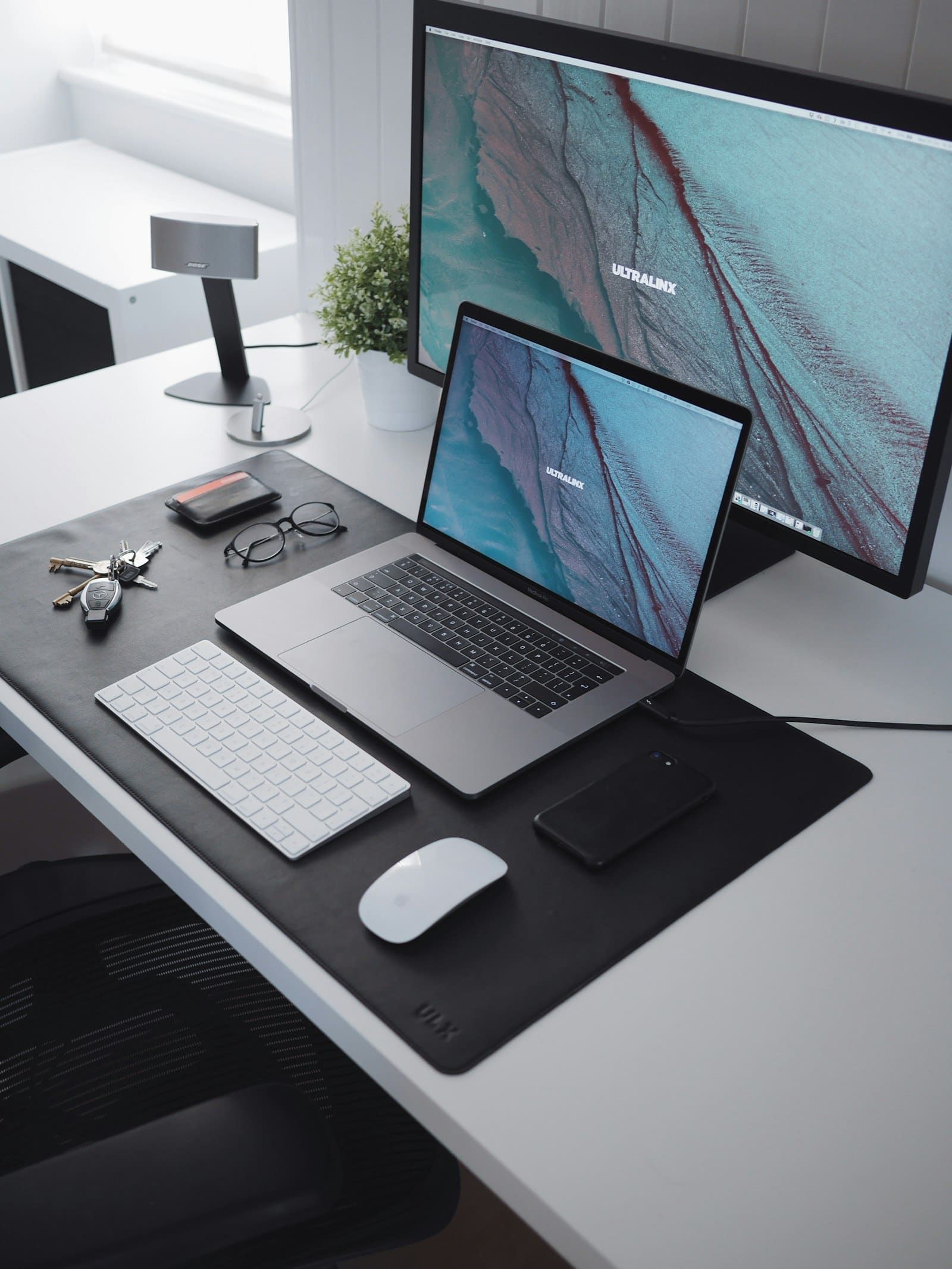 A clean minimalist desk with a MacBook, ready for a focused work session