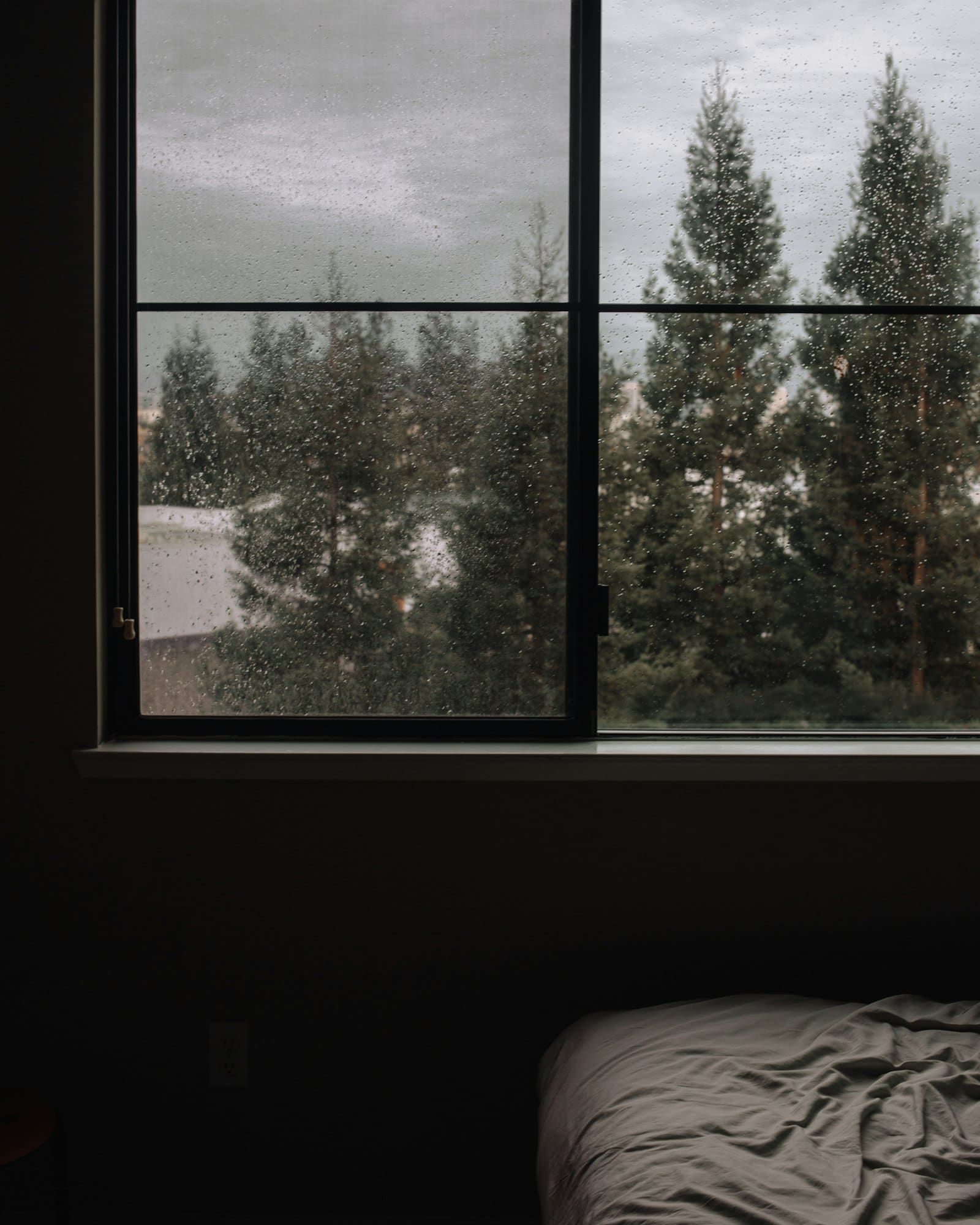A cozy rainy window scene, the kind of ambient mood Noisli evokes